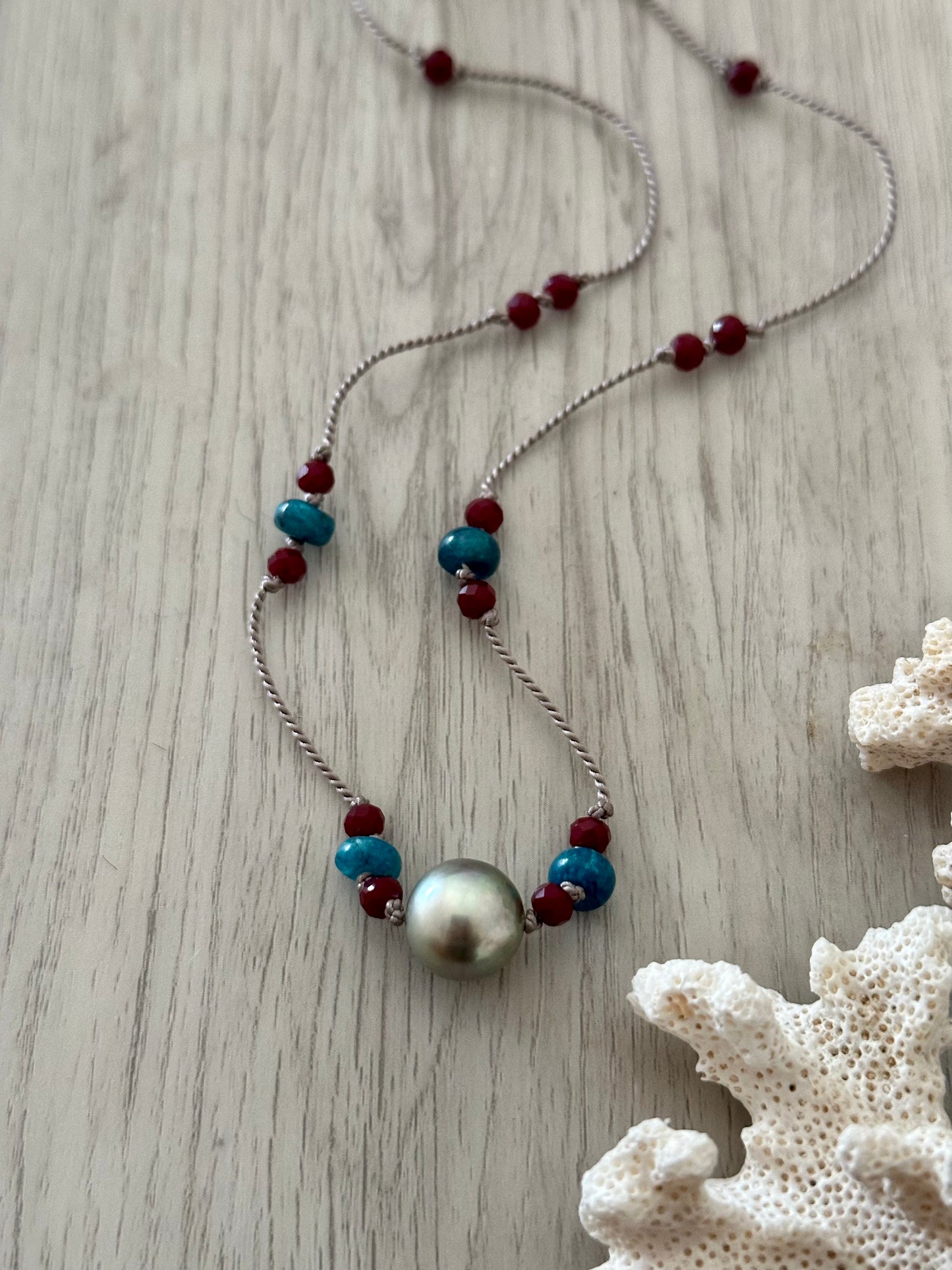 Oceanic Majesty: Tahitan Pearl and Ruby Silk Necklace