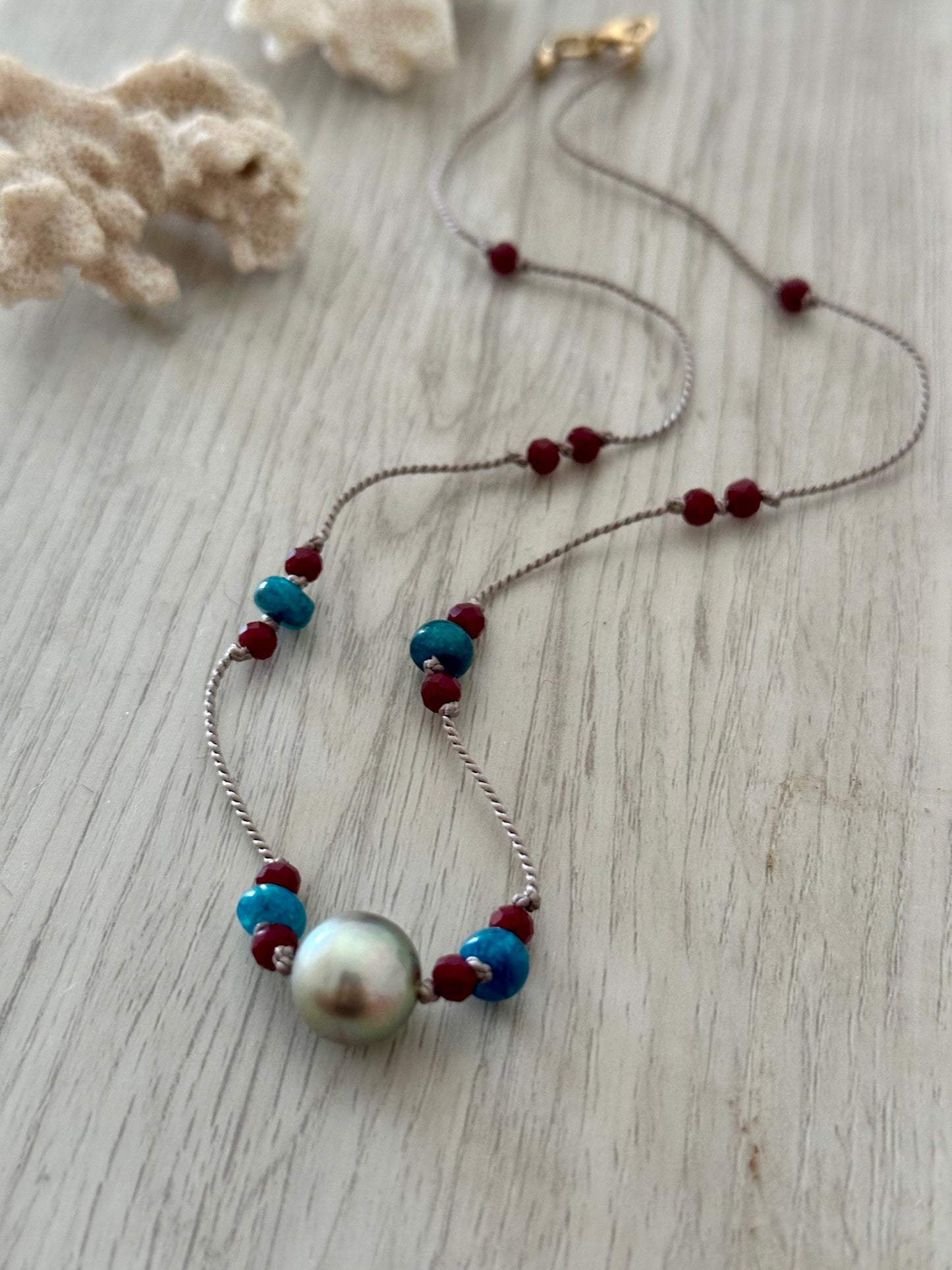 Oceanic Majesty: Tahitan Pearl and Ruby Silk Necklace