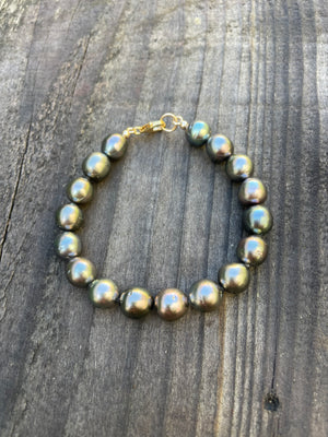11mm tahitian pearls strung into a bracelet with a gold filled clasp