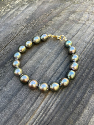 11 mm tahitian pearls strung into a bracelet with gold filled clasp